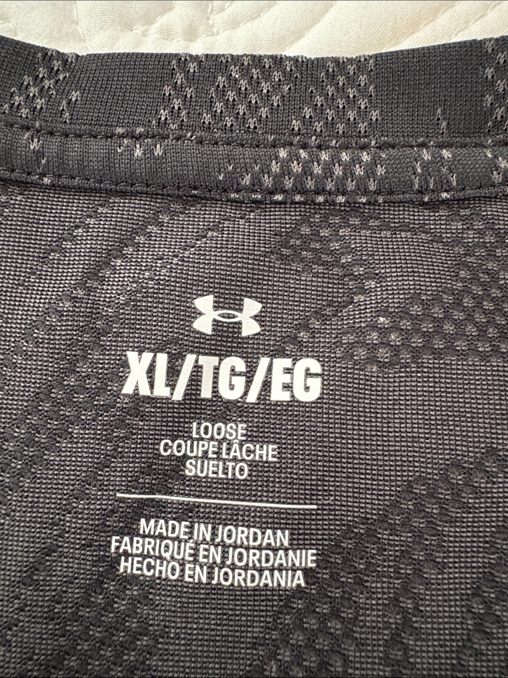 Under Armour Black Short-Sleeve V-Neck Performance Tee with Subtle Swirl Pattern - Picture 2 of 5